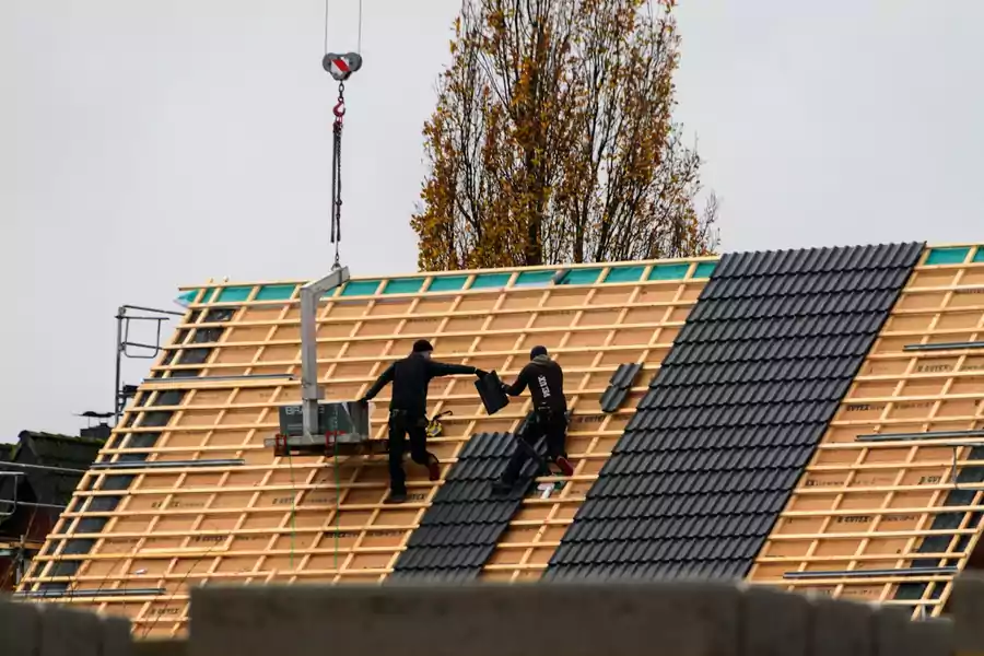 Rénovation de toiture avec pose de tuiles neuves – charpente Lille